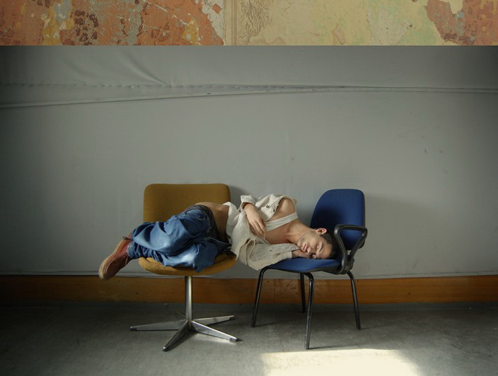Boy_sleeping_on_chairs